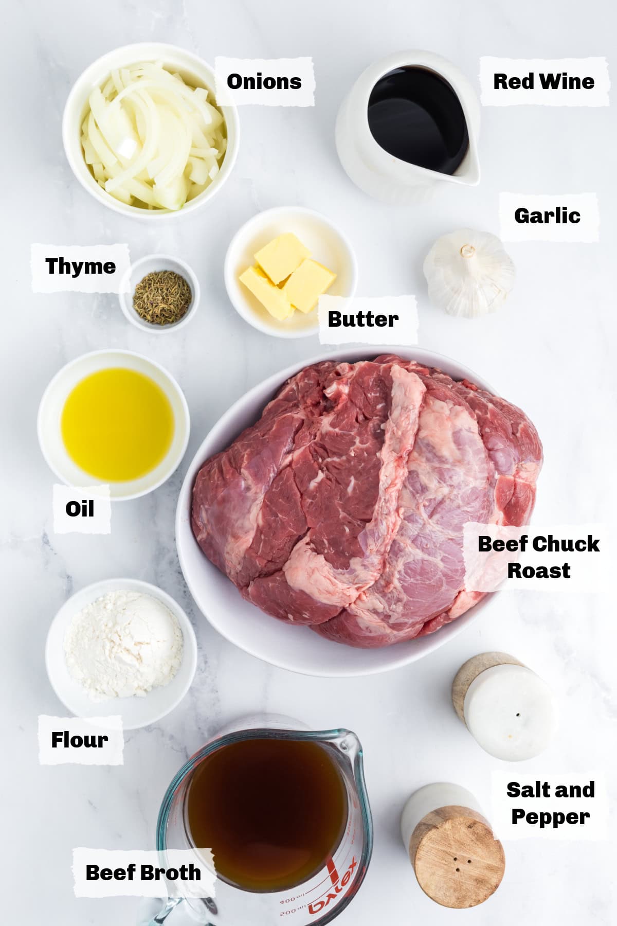 Ingredients on a table to make french onion roast.