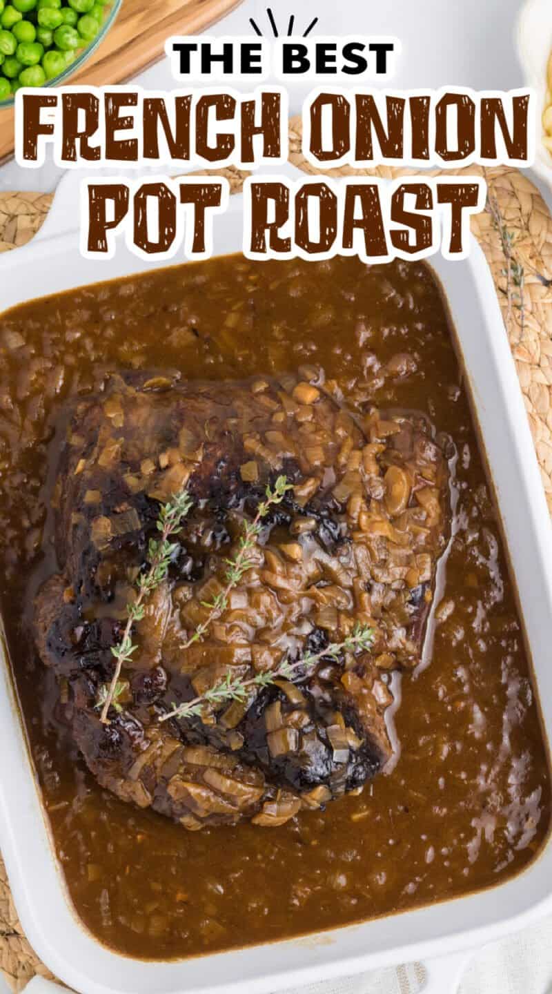 A white casserole dish filled with french onion beef roast and peas on the side in a bowl.