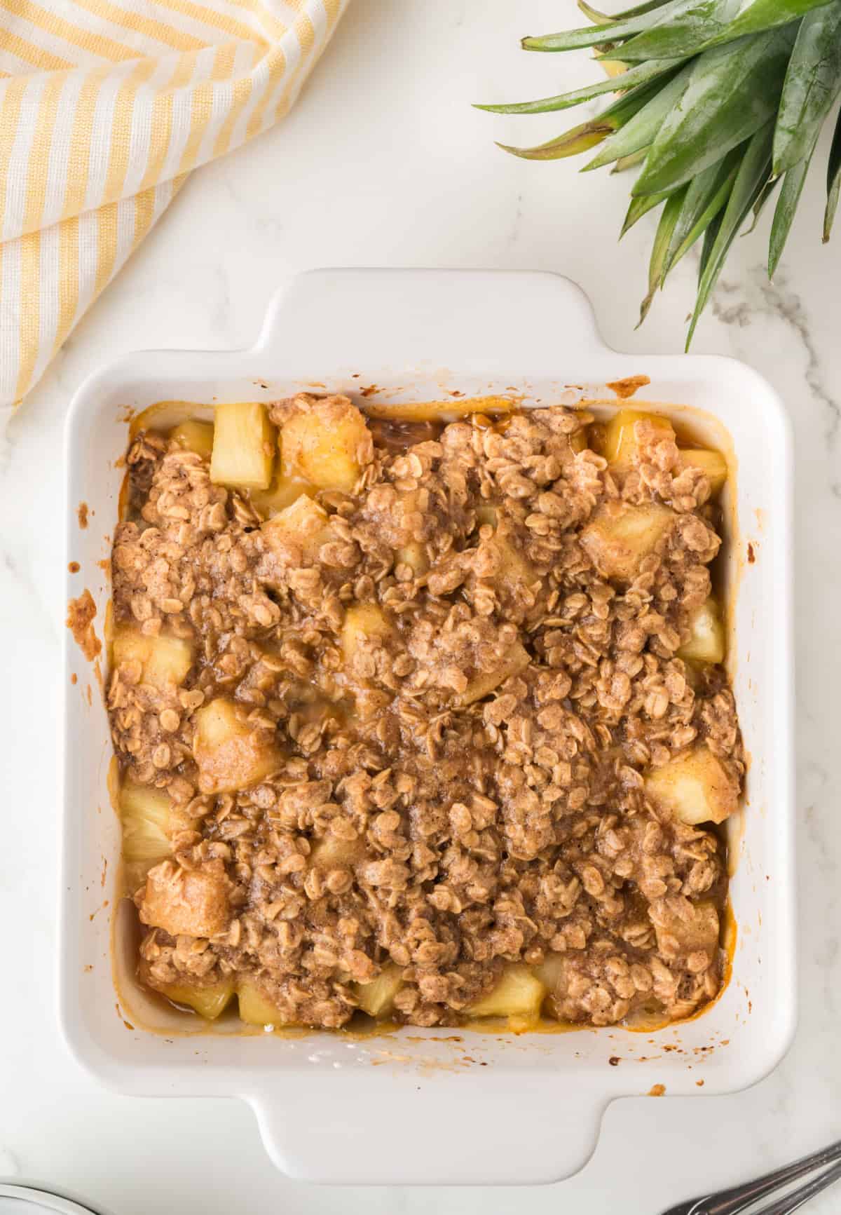 a baking dish of pineapple crisp.