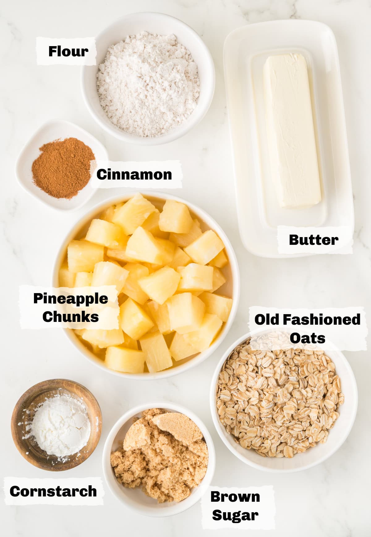ingredients on a table to make pineapple crisp.