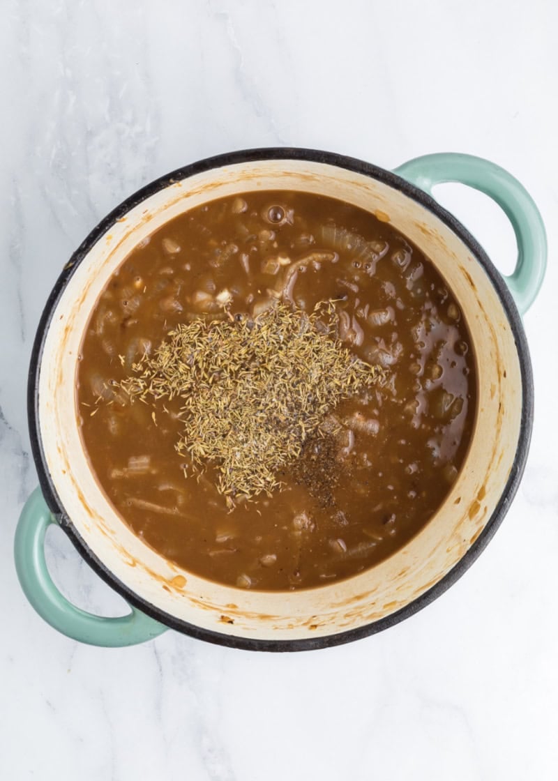 a oven dish with french onion sauce and spices in it.