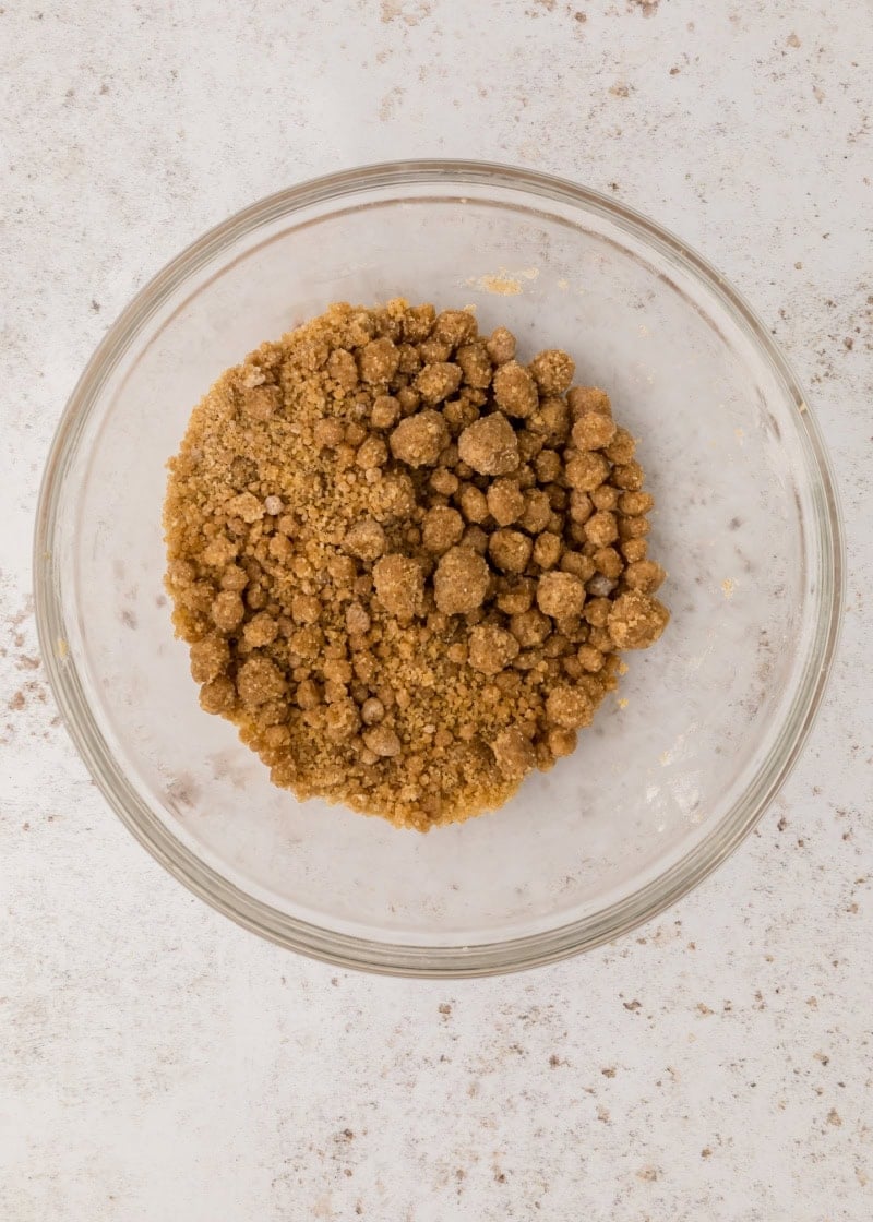 streusel in a glass bowl on a table.