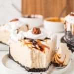 a slice of frozen turtle pie on a plate with a forkful beside it.