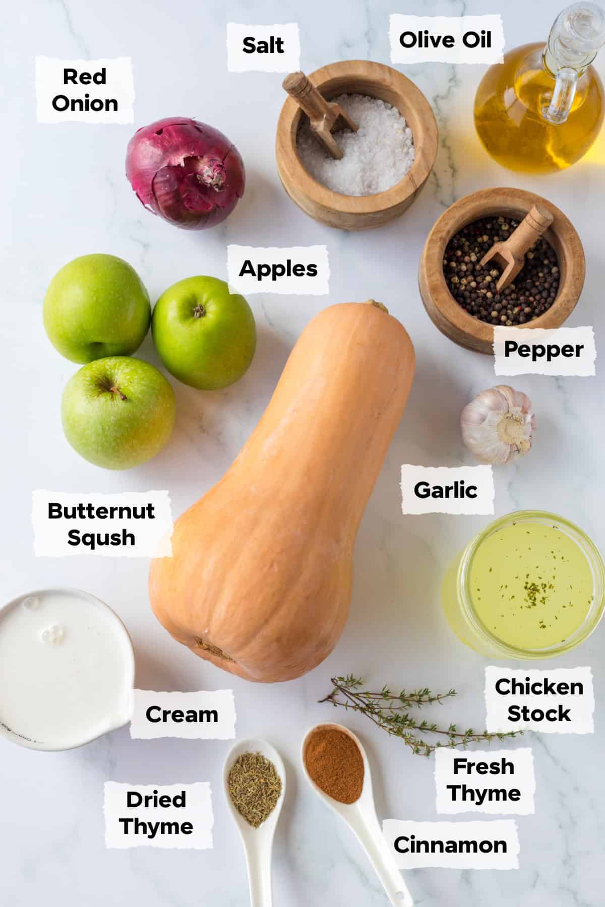 Ingredients on a table to make apple butternut squash soup.