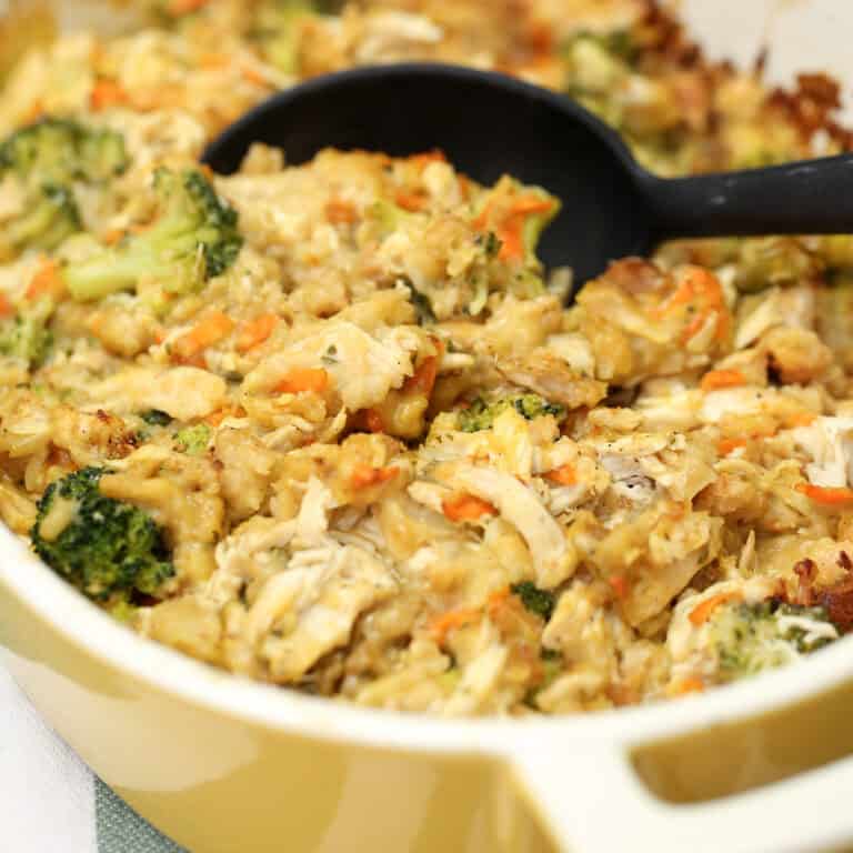 Chicken and Stuffing Casserole in a baking dish with a serving spoon.