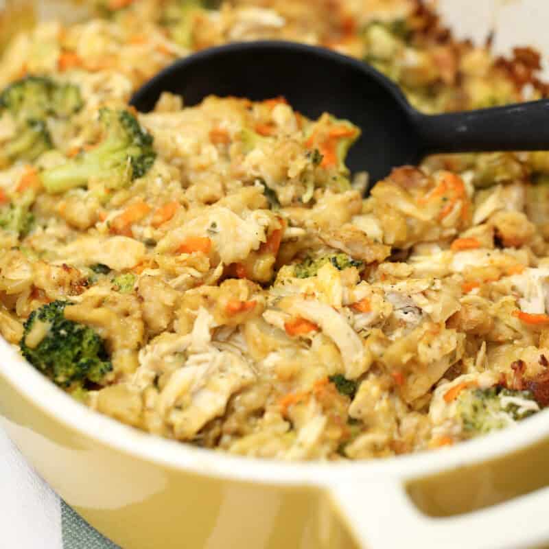 Chicken and Stuffing Casserole in a baking dish with a serving spoon.