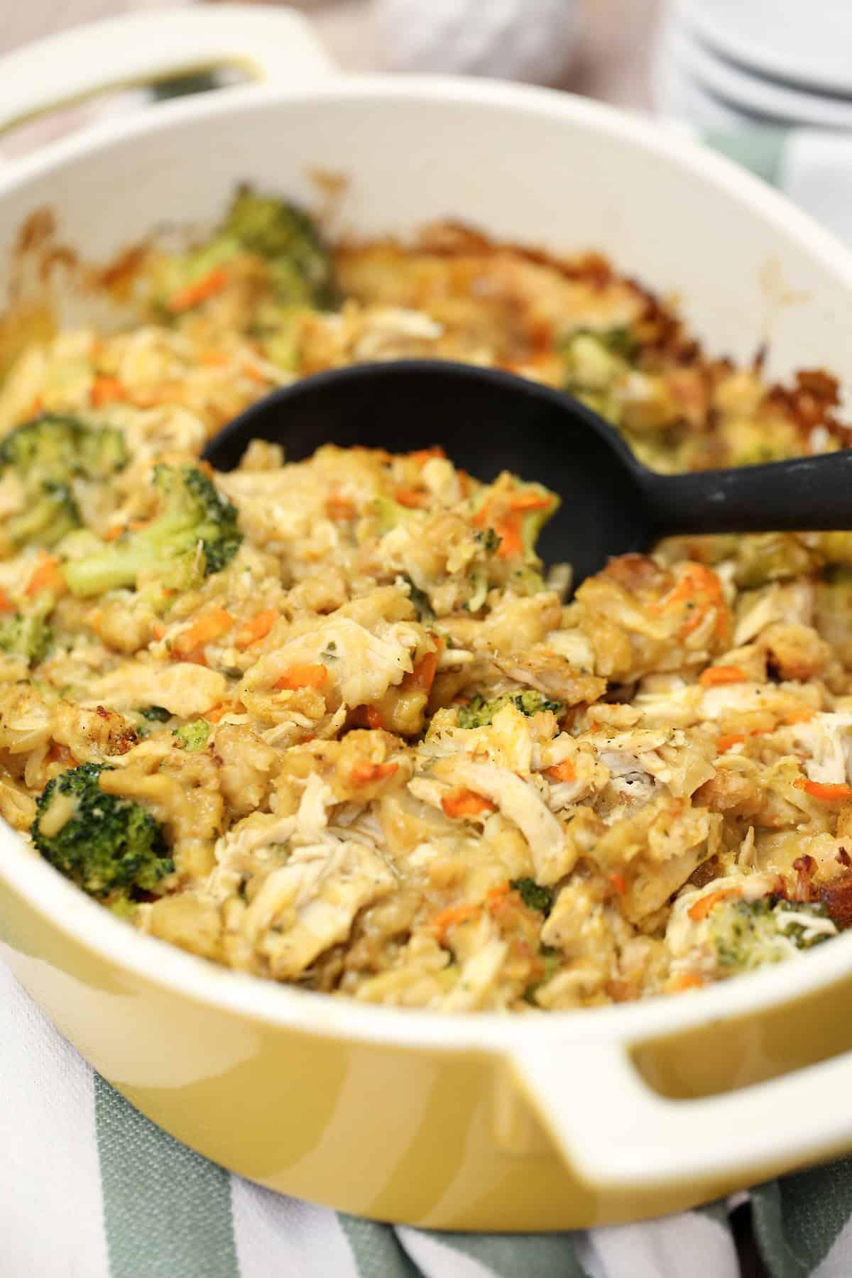 Chicken and Stuffing Casserole in a baking dish with a serving spoon.