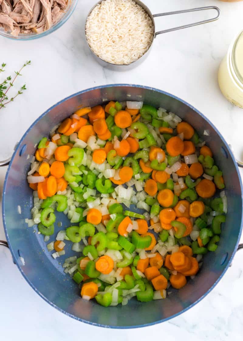 chopped carrots and celery in a large pot to make soup.