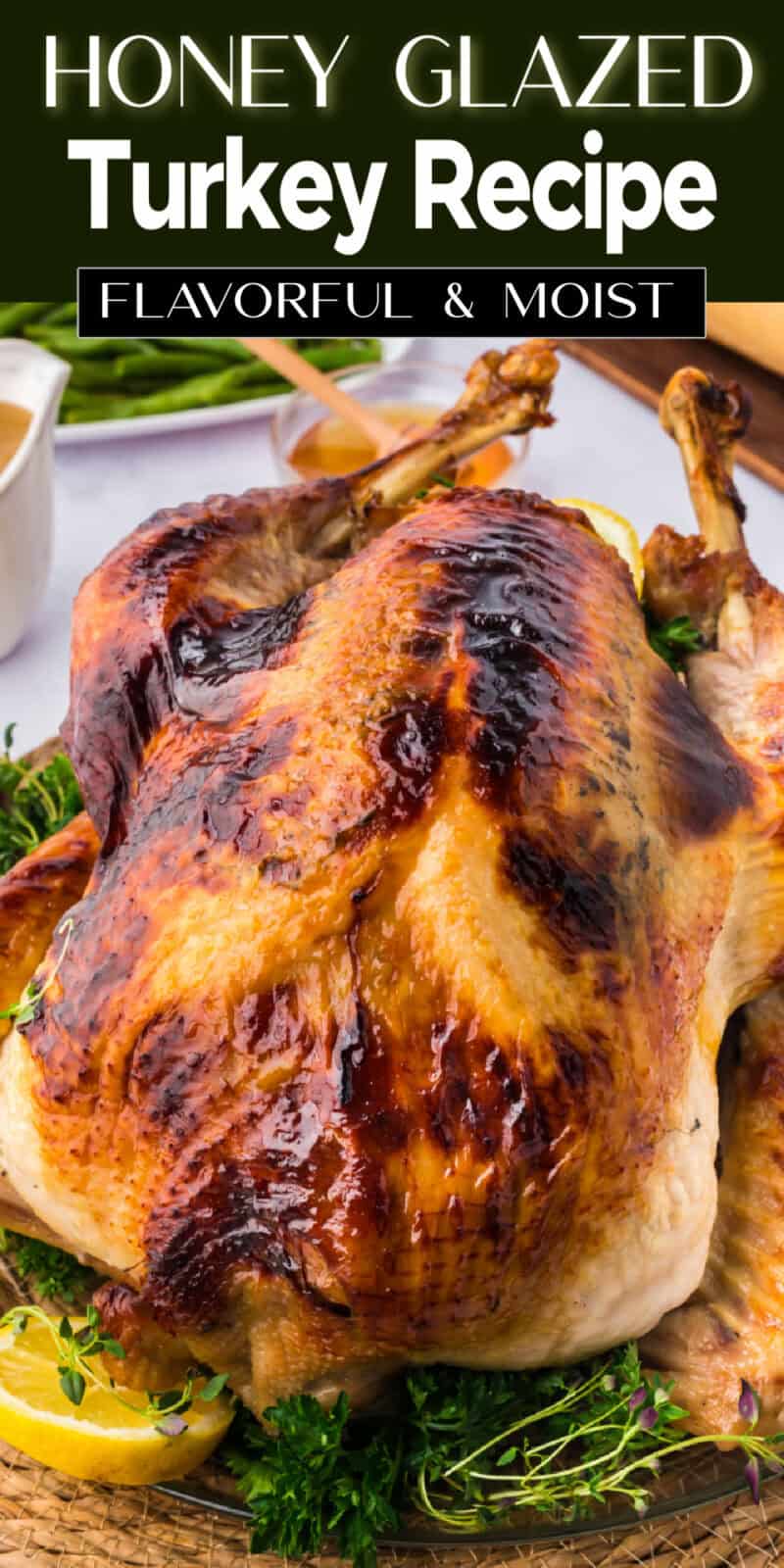 a whole cooked honey baked turkey on a table.