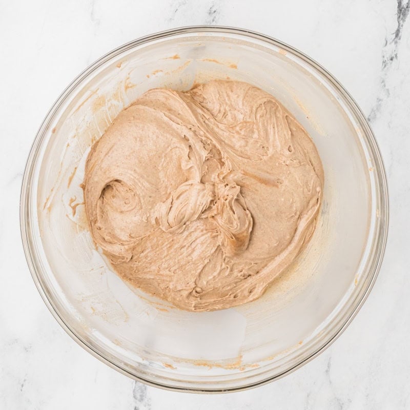 a bowl of uncooked cake mix cookies batter.