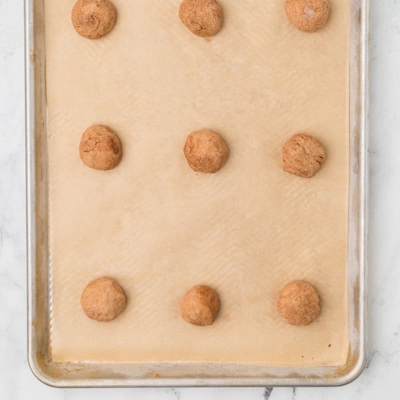 uncooked balls of Spice Cake Mix Cookies on baking pan.