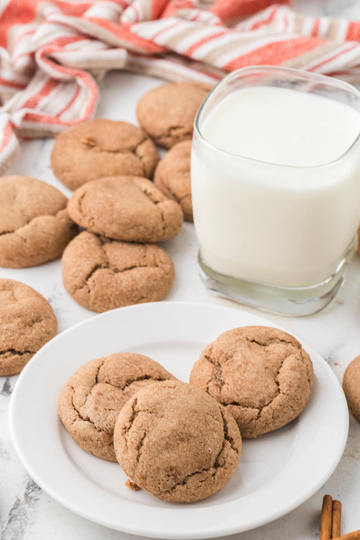 Spice Cake Mix Cookies on a white plate with a glass of milk beside it.