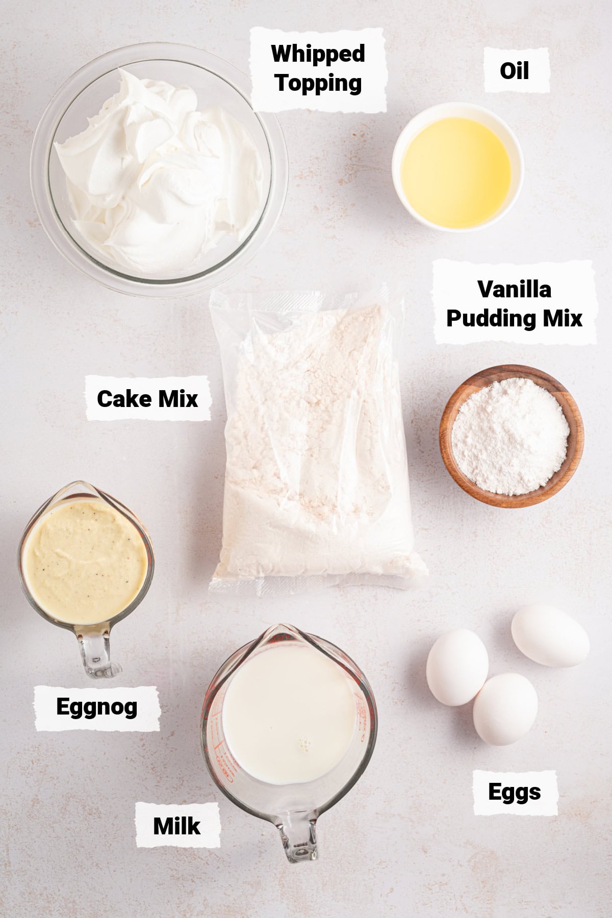 ingredients on a table to make eggnog poke cake.