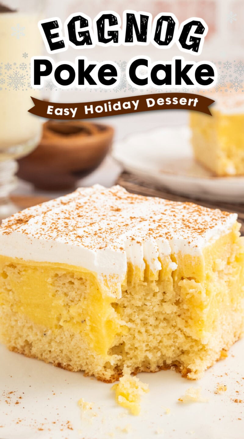 a slice of eggnog poke cake on a plate with a bite taken out of it.