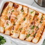 Cooked Turkey Enchiladas in a baking dish.