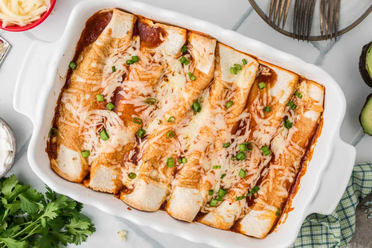 Cooked Turkey Enchiladas in a baking dish.
