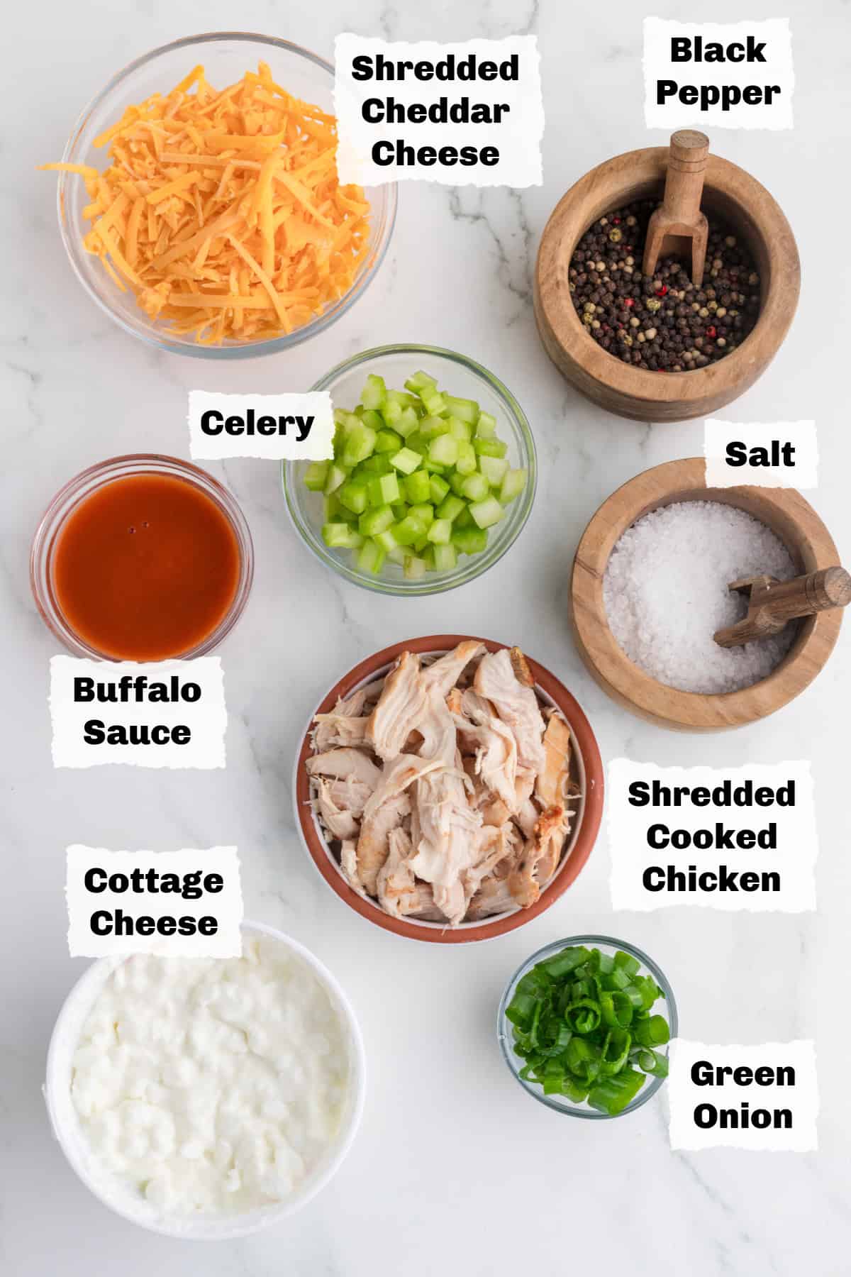 ingredients on a table to make cottage cheese buffalo chicken dip.