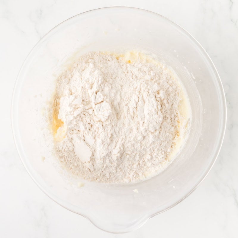 flour and butter in a glass mixing bowl.