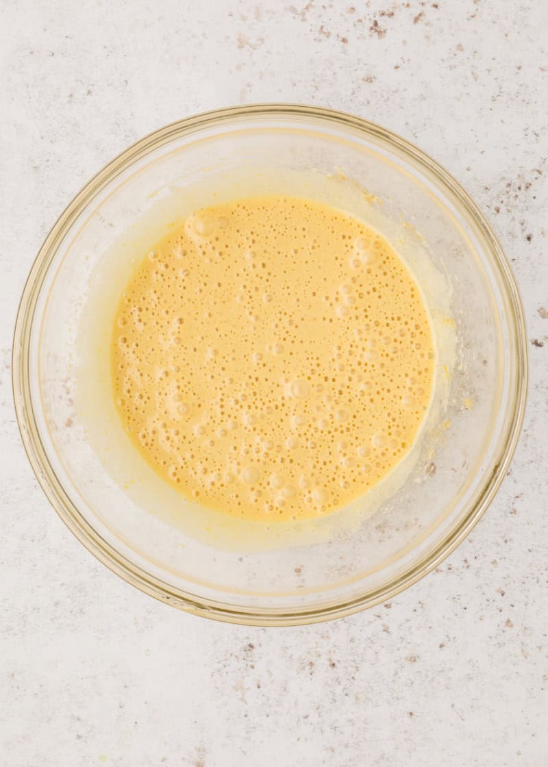 beaten eggs in a glass bowl.