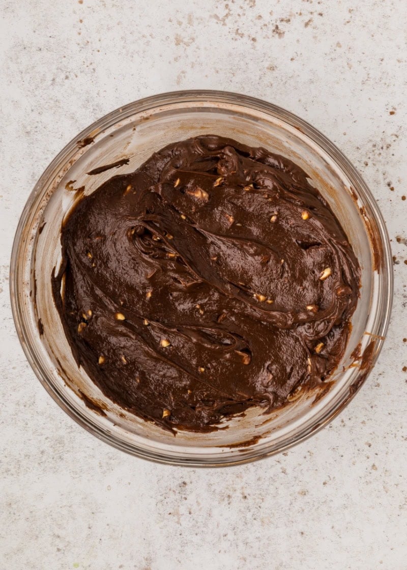 snickers brownie batter in a glass bowl.