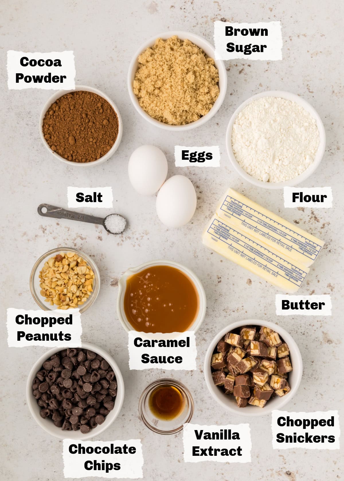 Ingredients to make snickers brownies on a table.