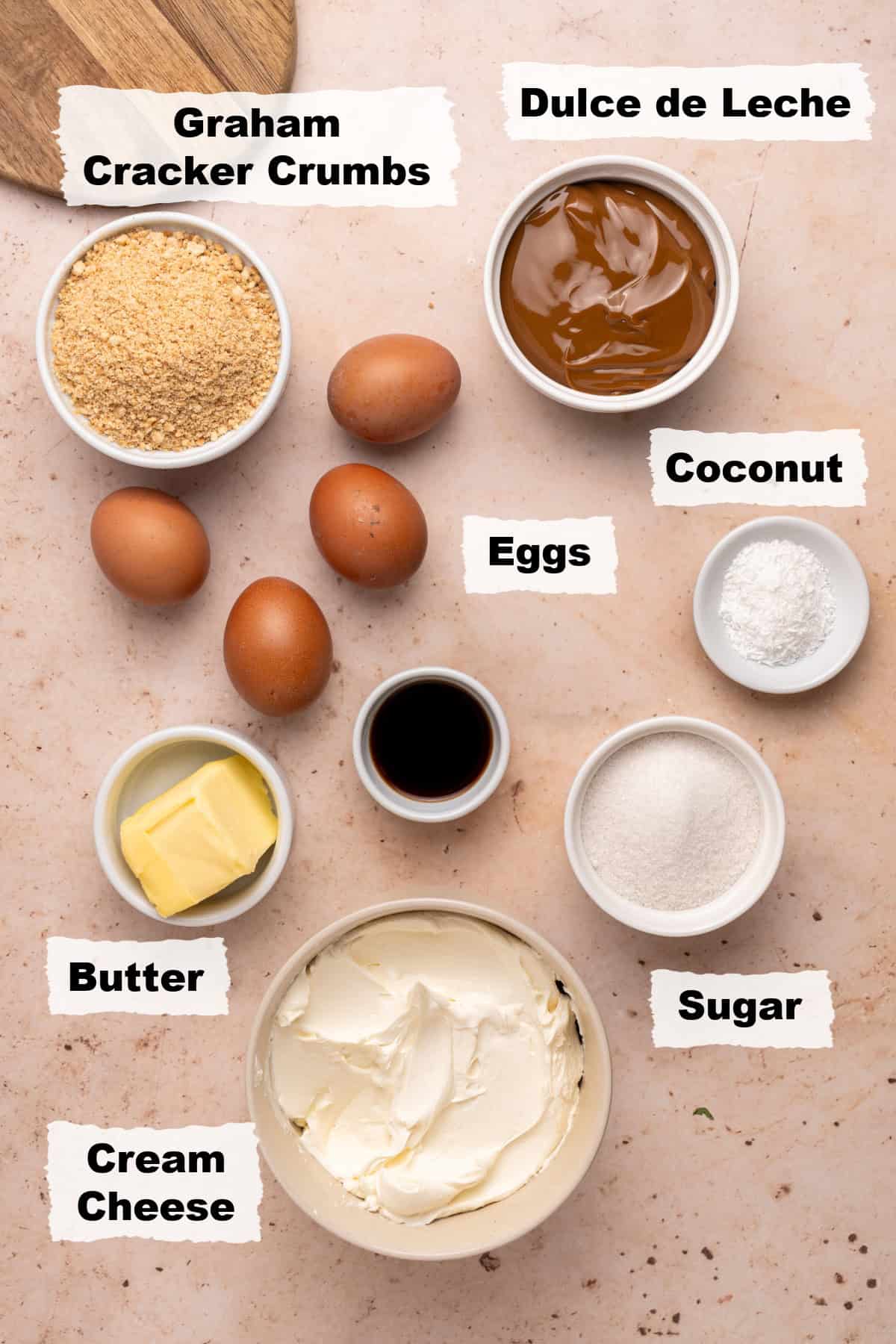 Ingredients on a table to make Dulce de Leche Cheesecake.