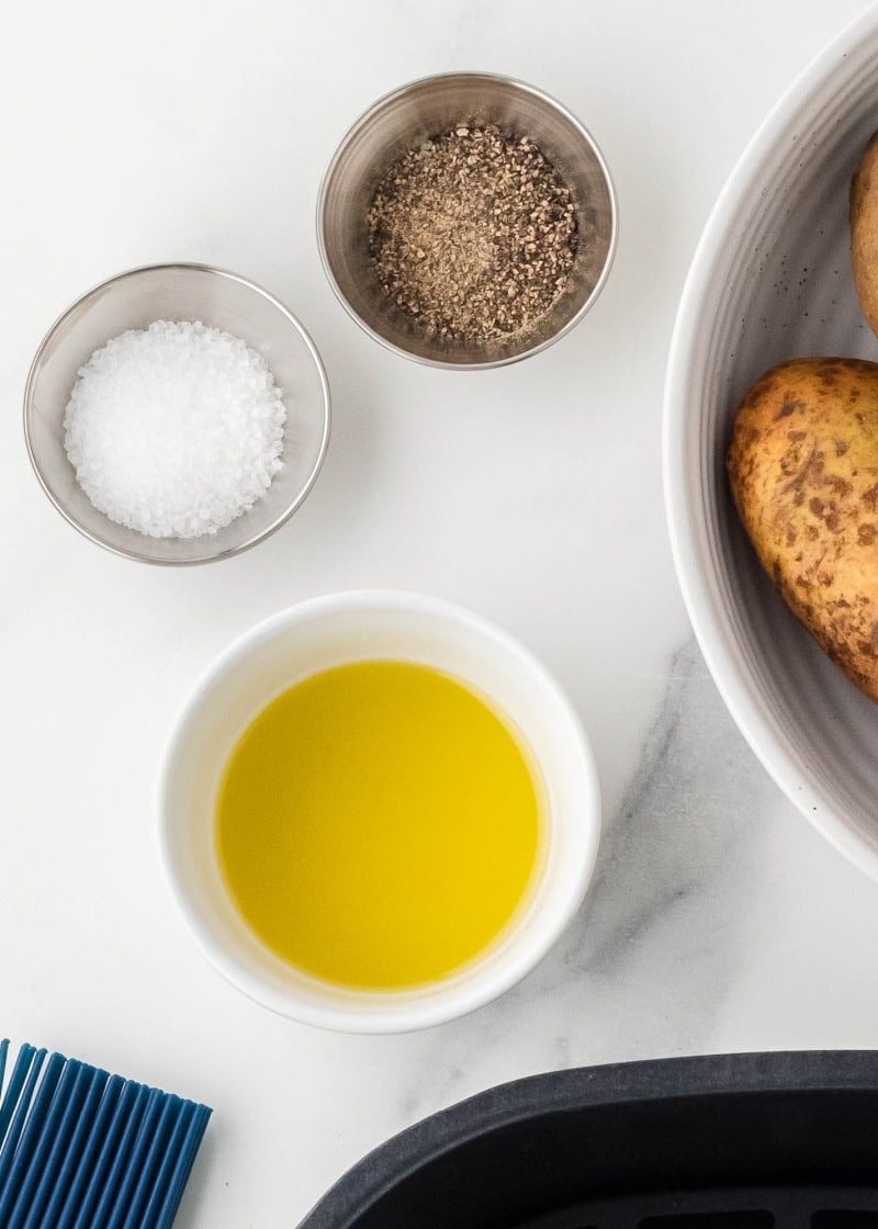 a bowl of olive oil, salt and pepper.