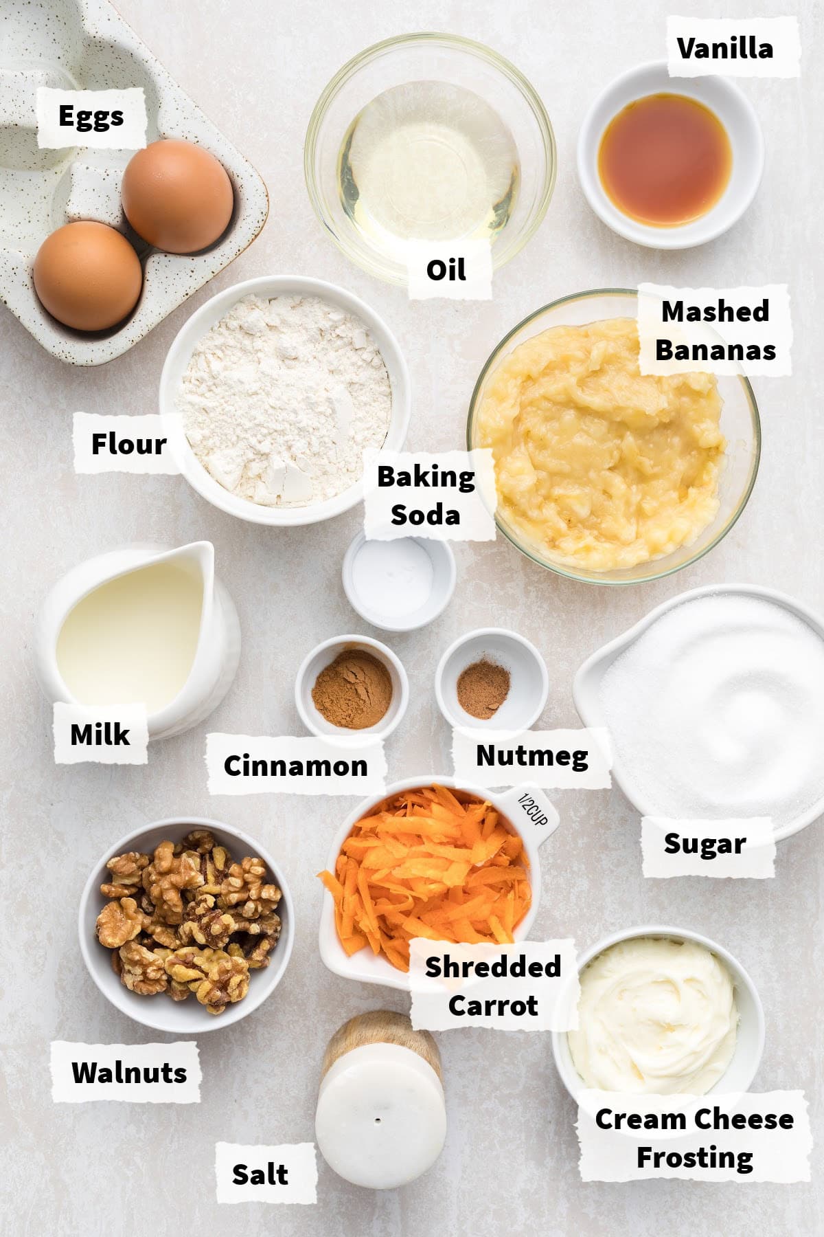 Ingredients on a table to make Carrot Cake Banana Bread.