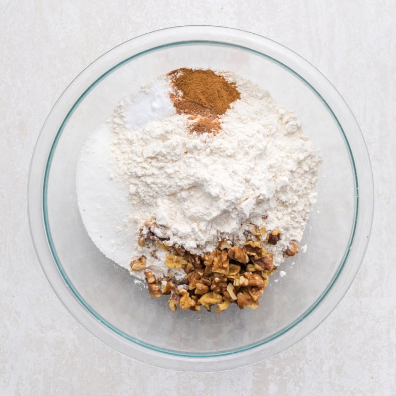 flour and walnuts in a glass bowl.