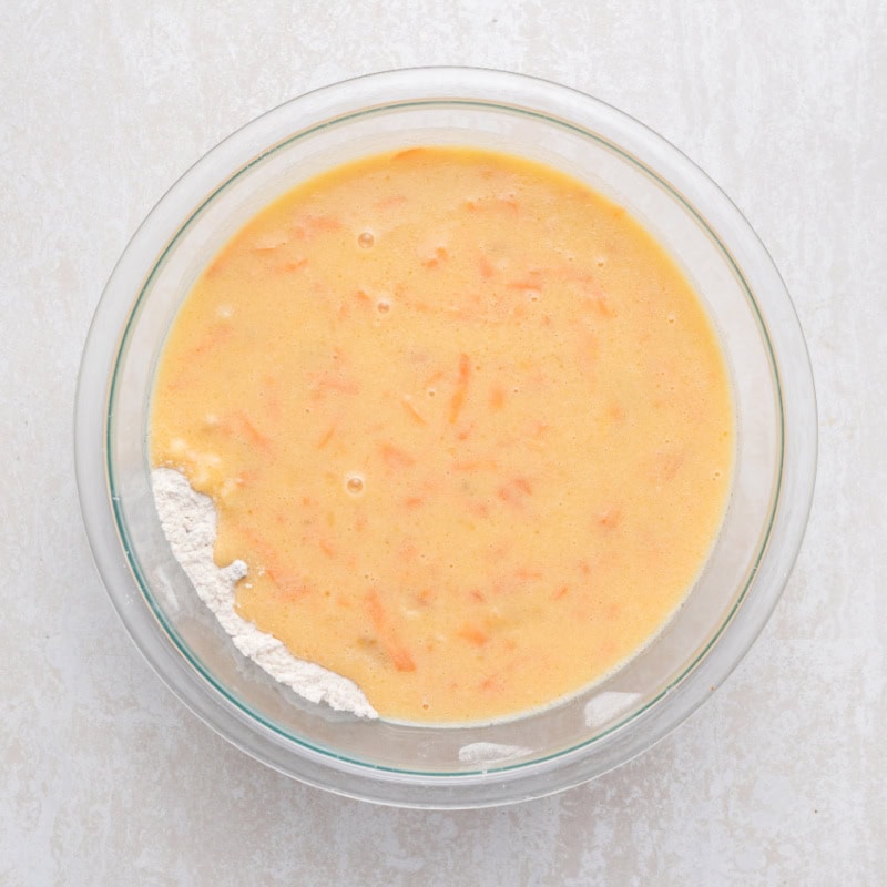 Carrot Cake Banana Bread batter in a glass bowl.