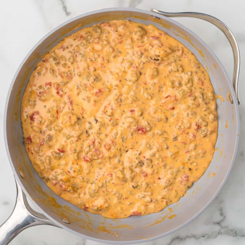 Rotel Dip being cooked in a saucepan.