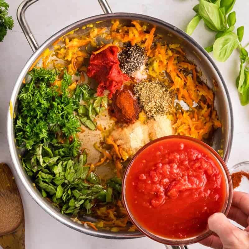 Making Homemade Spaghetti Sauce in a large pot.