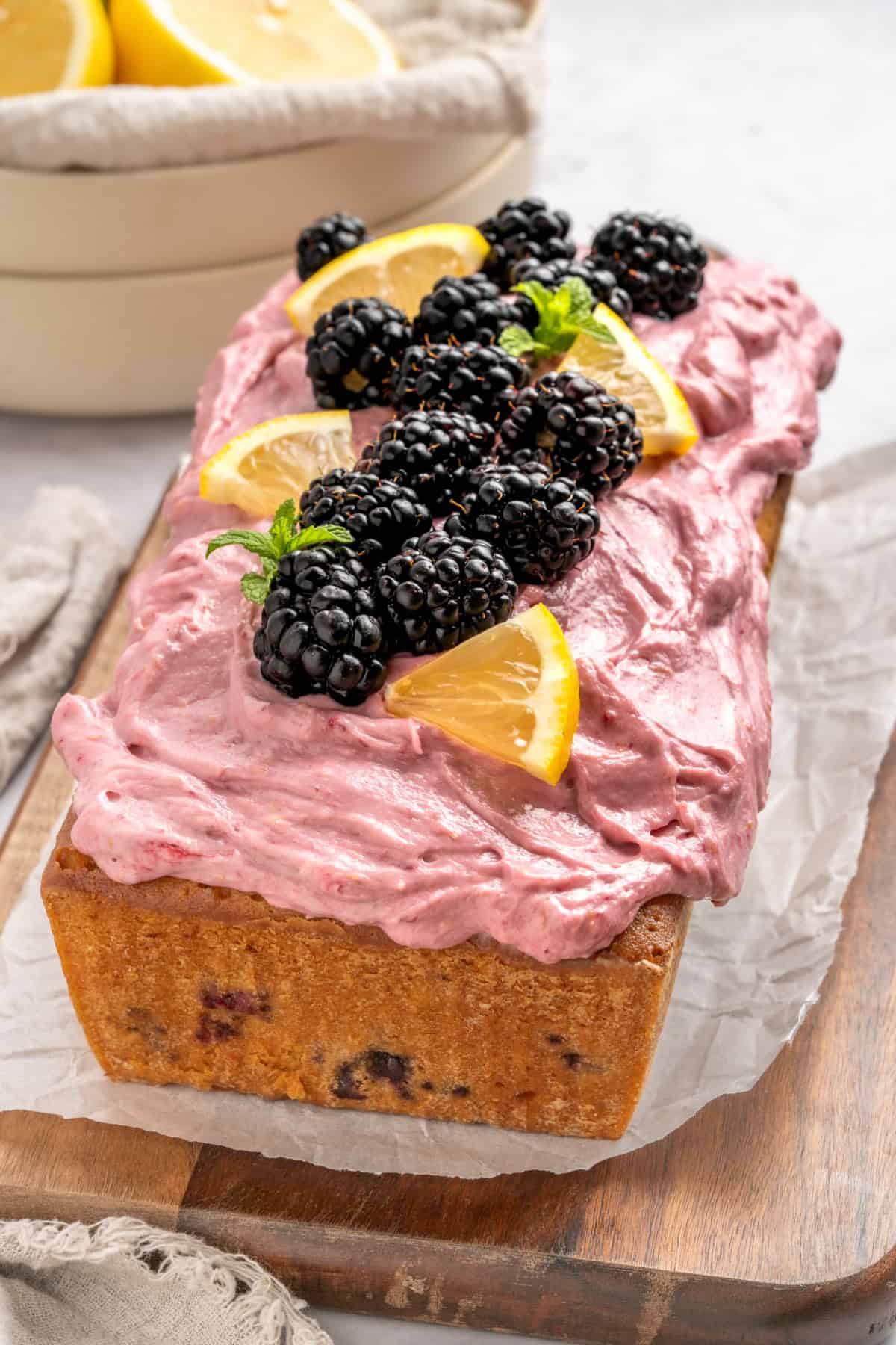 A whole glazed Blackberry Lemon Loaf on a table.