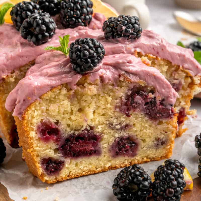 Sliced Blackberry Lemon Loaf with fresh blackberries.