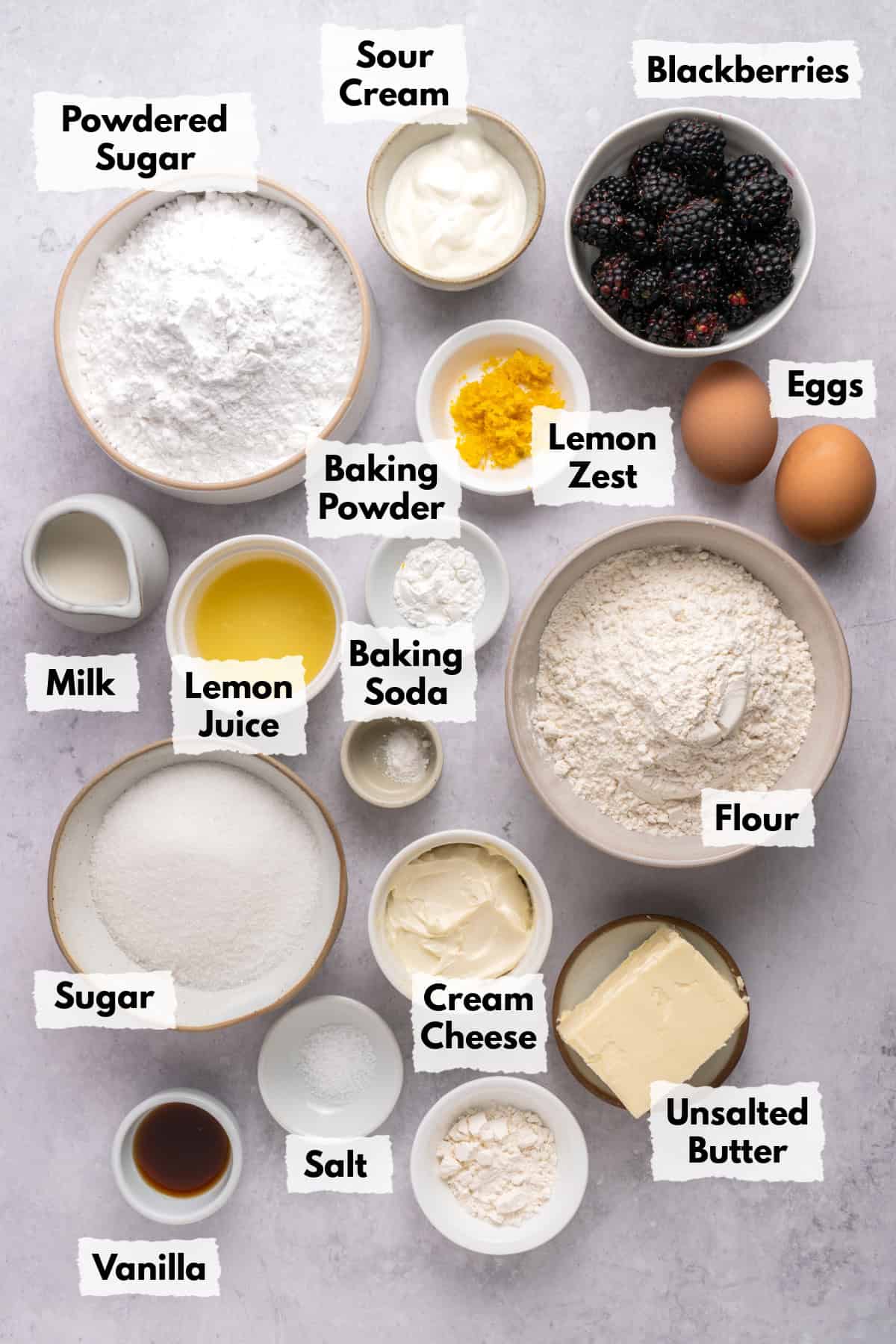 Ingredients on a table to make Blackberry Lemon Bread Loaf.