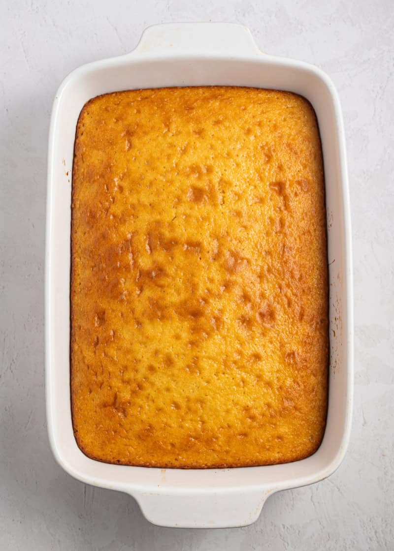 A whole baked cake in a baking pan.