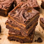 Three Mexican brownies swirled with dulce de leche piled on top of each other.