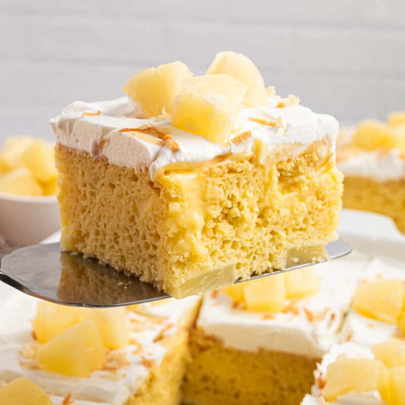 A slice of Pineapple Poke Cake.
