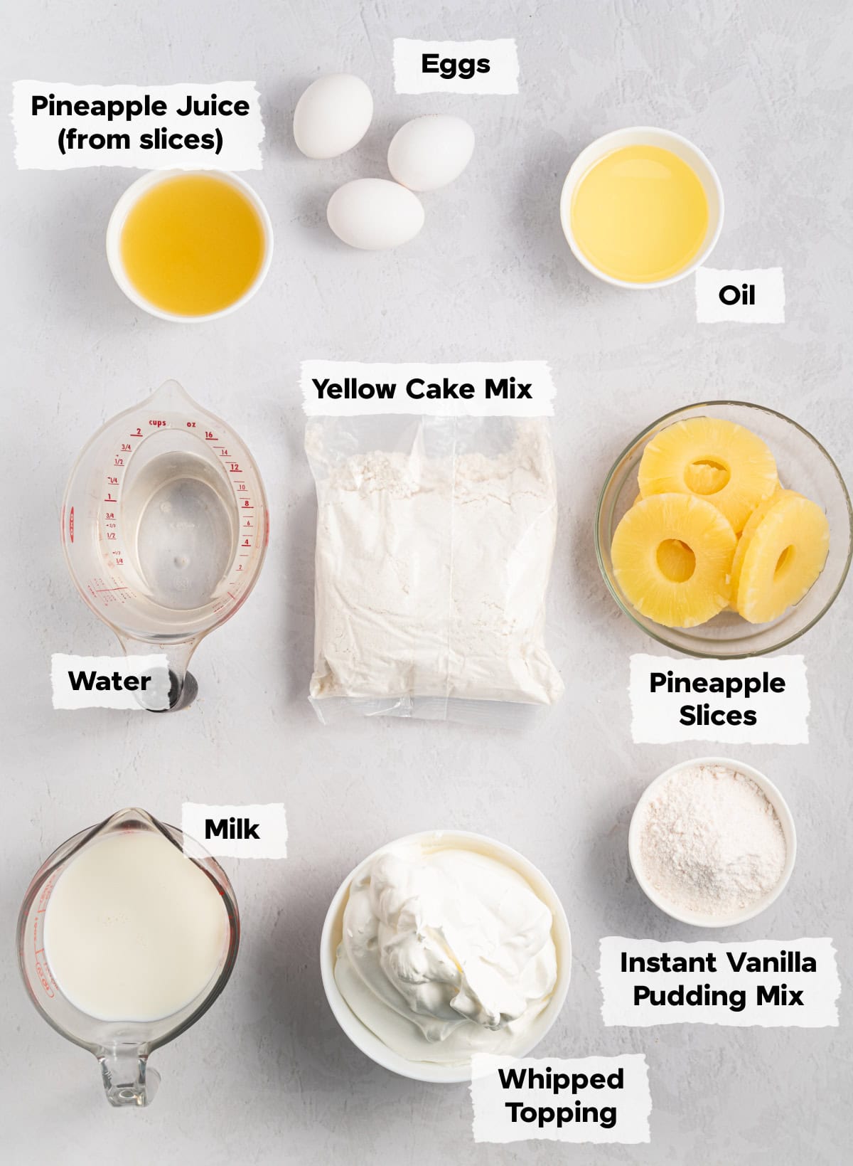 Ingredients on a table to make Pineapple Poke Cake.