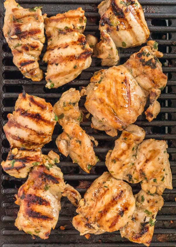 Thai BBQ Chicken being cooked on a grill.