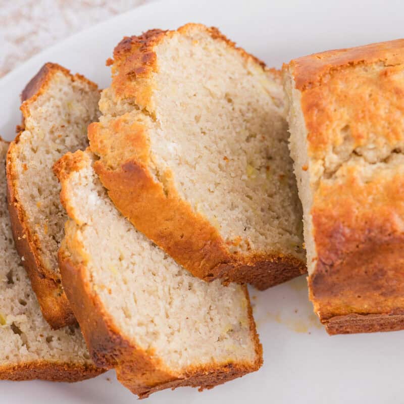 Sliced Bisquick Banana Bread on a white plate.