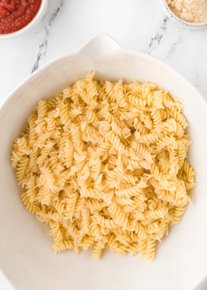 cooked pasta in a white bowl.