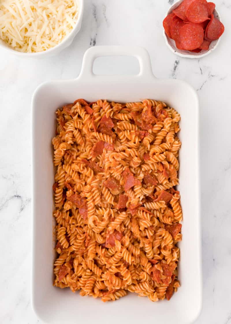 pasta and pepperoni in a casserole dish.