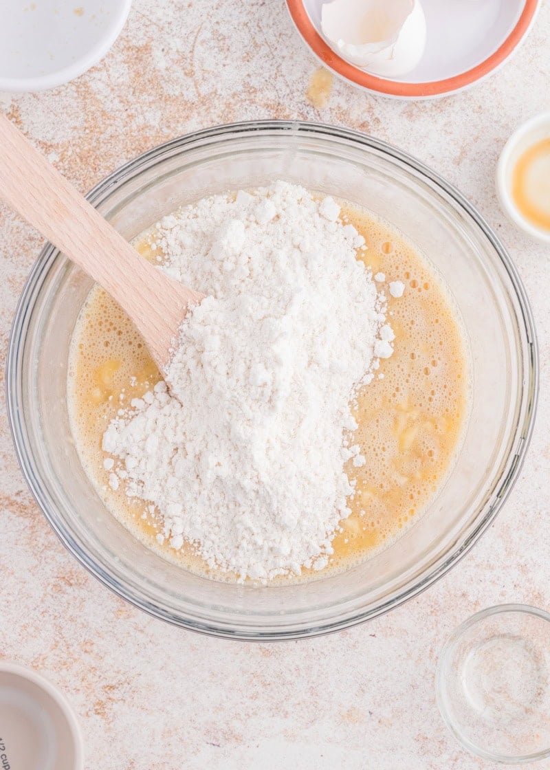 bisquick being added to banana bread batter.