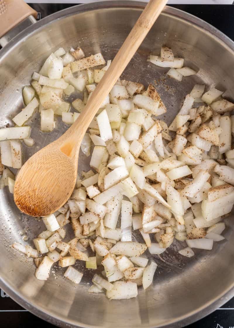 onion cooking in a frying pan.