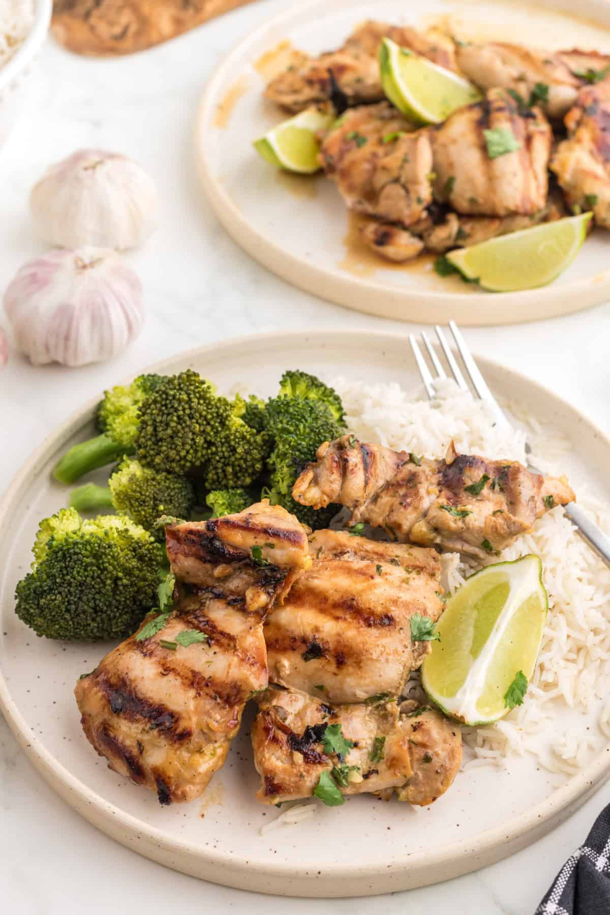 Thai BBQ Chicken on a plate with rice and broccoli.