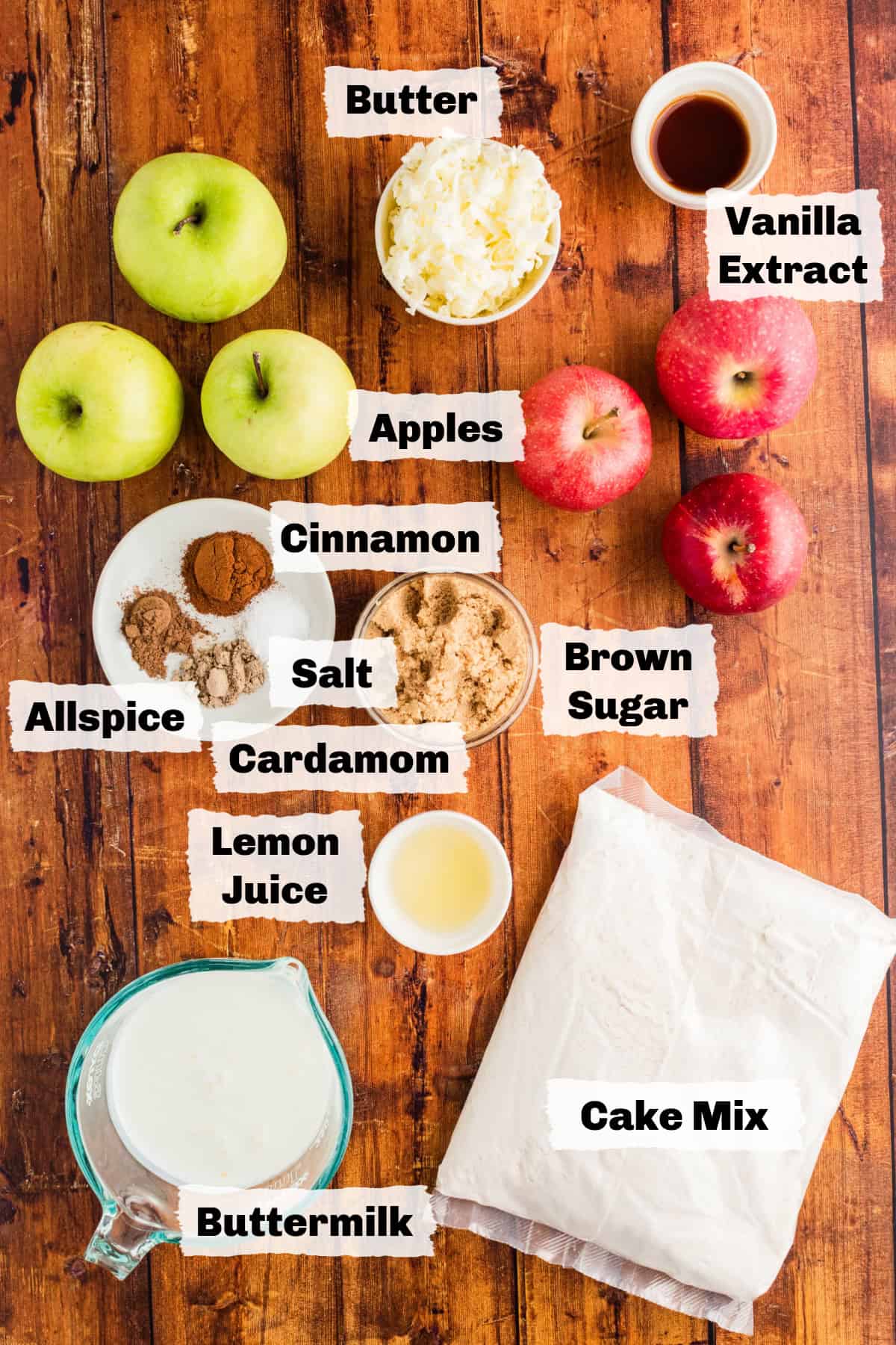 Ingredients on a table to make cake mix apple cobbler.