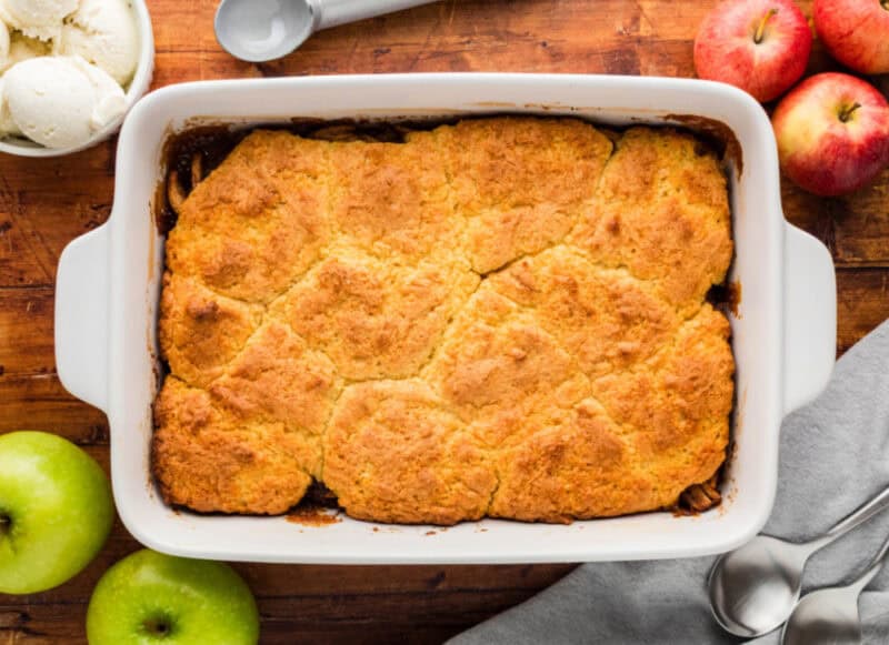 Baked Apple Cobbler made with Cake Mix in a white baking pan on a table.