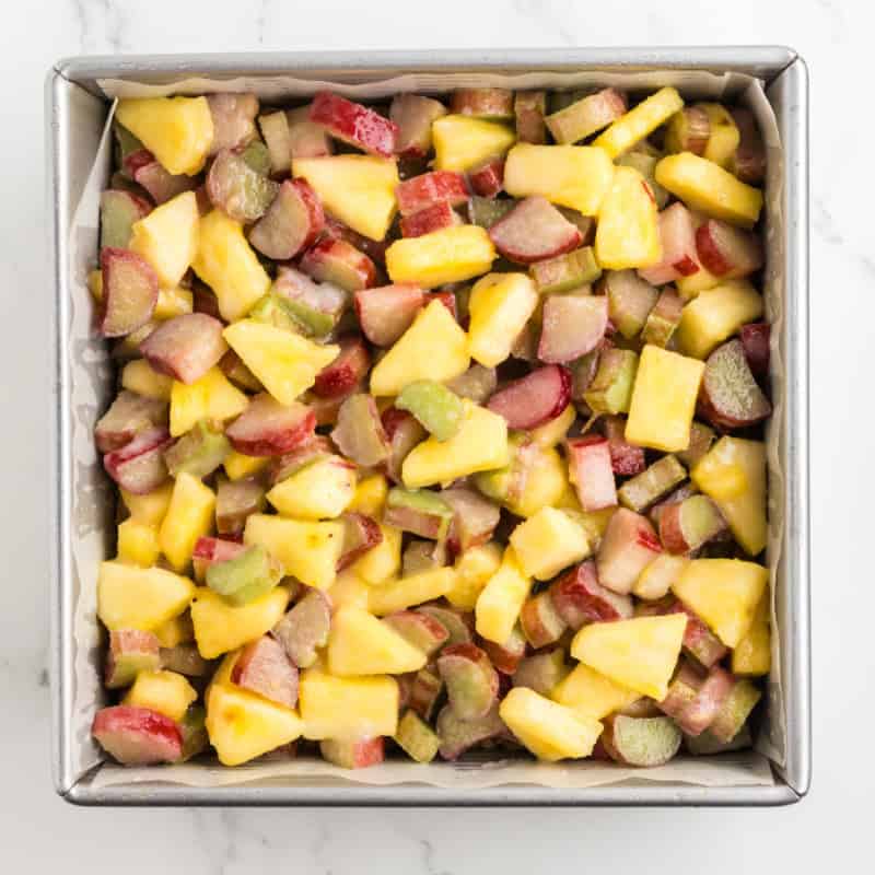 pineapple rhubarb filling for squares n a baking pan.