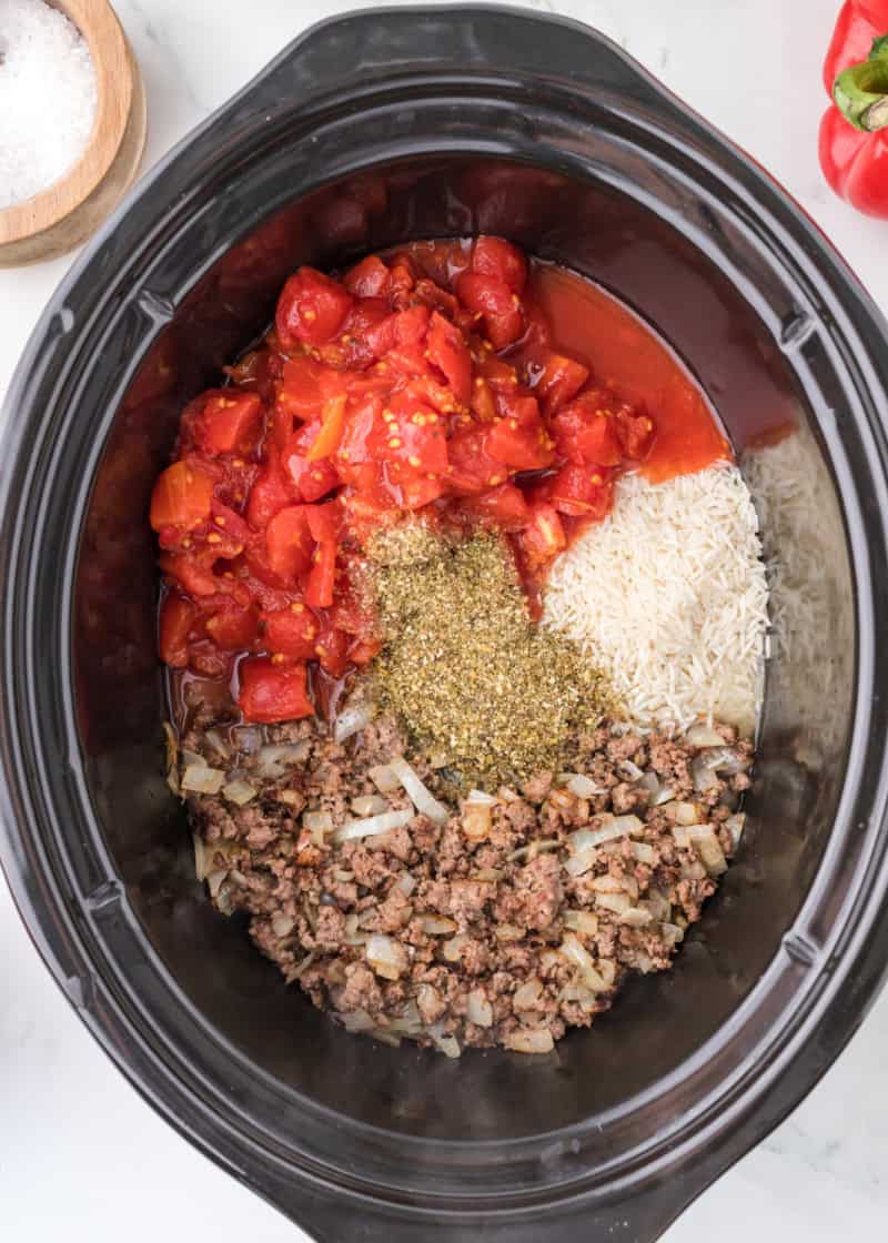 Ingredients in a crockpot to make Slow Cooker Stuffed Pepper Casserole.